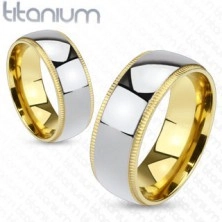 Titanium band of silver color with gold knurled border