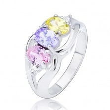 Glossy ring in silver colour, three colourful oval zircons between waves