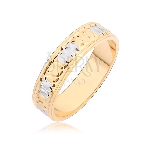 Gold band ring with circular notches and silver spots