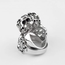 Steel 316L ring of silver colour - ten skulls with glaze of black colour 