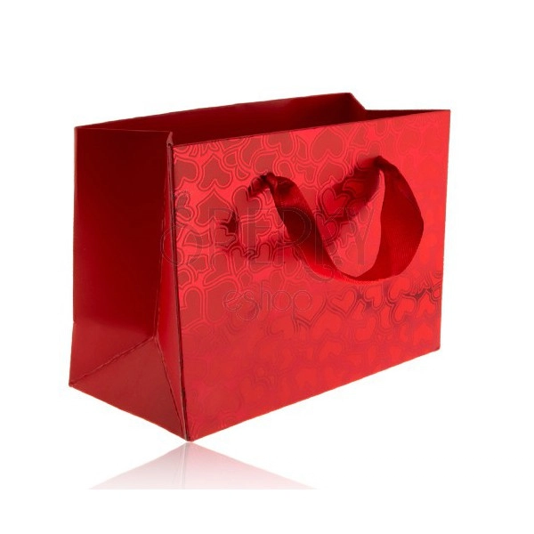Red gift bag, matt hearts on shiny background, red ribbons