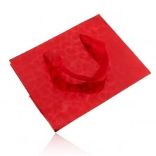 Red gift bag, matt hearts on shiny background, red ribbons