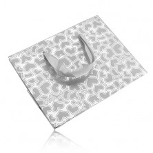 Gift bag of silver colour, matt hearts on shiny background