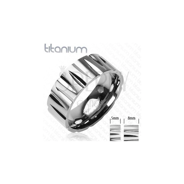 Titanium ring with bullet-shaped cuts