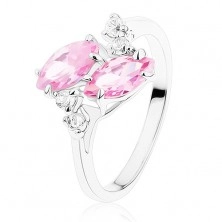 Shiny ring in silver hue, two pink zircon grains, clear zircons
