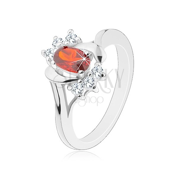 Ring in silver colour, red zircon, clear zircons, shiny arcs