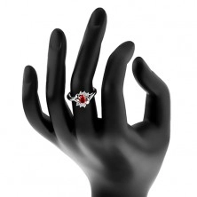 Ring in silver colour, red zircon, clear zircons, shiny arcs