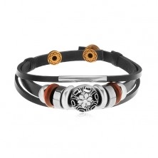 Bracelet made of black leather strips with beads made of metal and wood, circle with flower