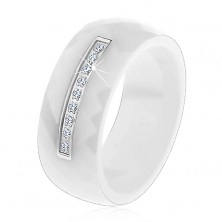 Ring made of white ceramic with cut surface, narrow steel line, zircons