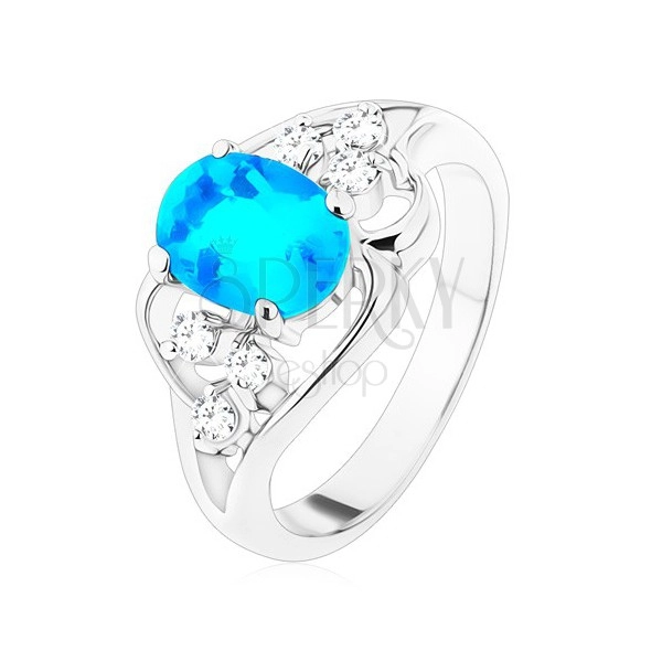 Ring in silver colour, big blue oval zircon, asymmetric lines