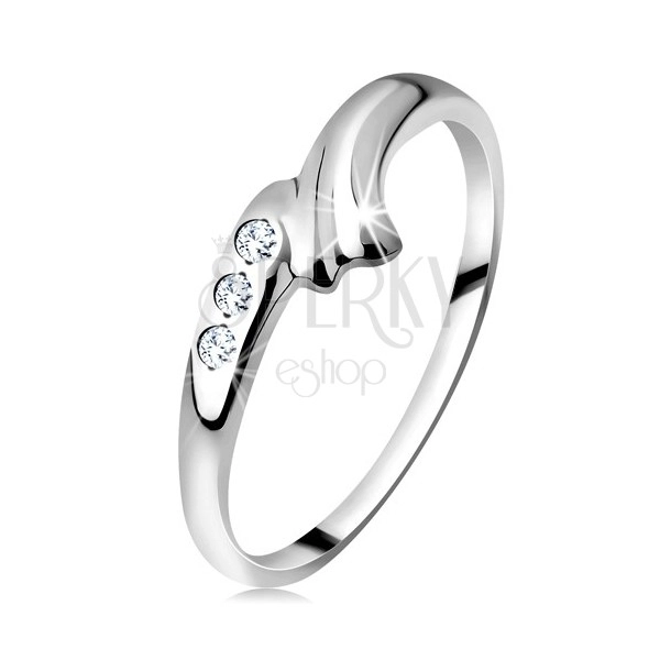Ring made of white 14K gold - bent shoulder with notch and triplet of clear zircons