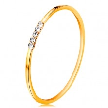 Ring made of yellow 14K gold - line of clear zircons, thin shiny shoulders