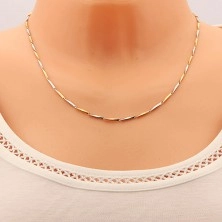 Chain made of 316L steel, narrow elongated links in gold and silver colour, 1,5 mm