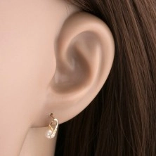 Earrings made of yellow 14K gold - shiny loop adorned with diamonds, round pearl