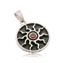 Round patinated pendant made of 316L steel, symbol of sun with red zircon