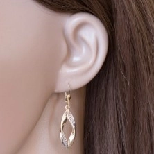 Dangling 585 gold earrings - curved grain contour with indents and white gold