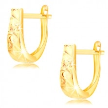 Earrings made of 14K gold - widening strip with waves and grain