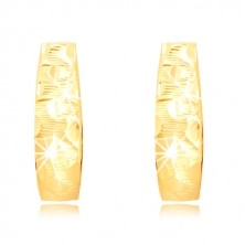 Earrings made of 14K gold - widening strip with waves and grain