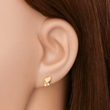 Yellow 14K gold earrings - glossy leaf with two clear zircons