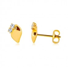 Yellow 14K gold earrings - glossy leaf with two clear zircons