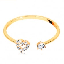 Ring made of yellow 375 gold - shiny shoulders ending in heart contour and clear zircon
