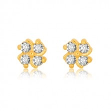 Yellow 375 gold earrings - flower with four zircons and lines slightly twisted