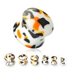 White ear plug with black and orange spots