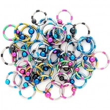 Anodized titanium eyebrow piercing - striped with ball