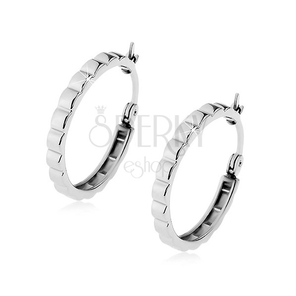 Steel earrings in silver colour, shiny circles with diagonal notches